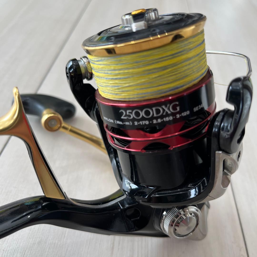 j2500DXG スピニングリール ブラック/ゴールドベイシス竿