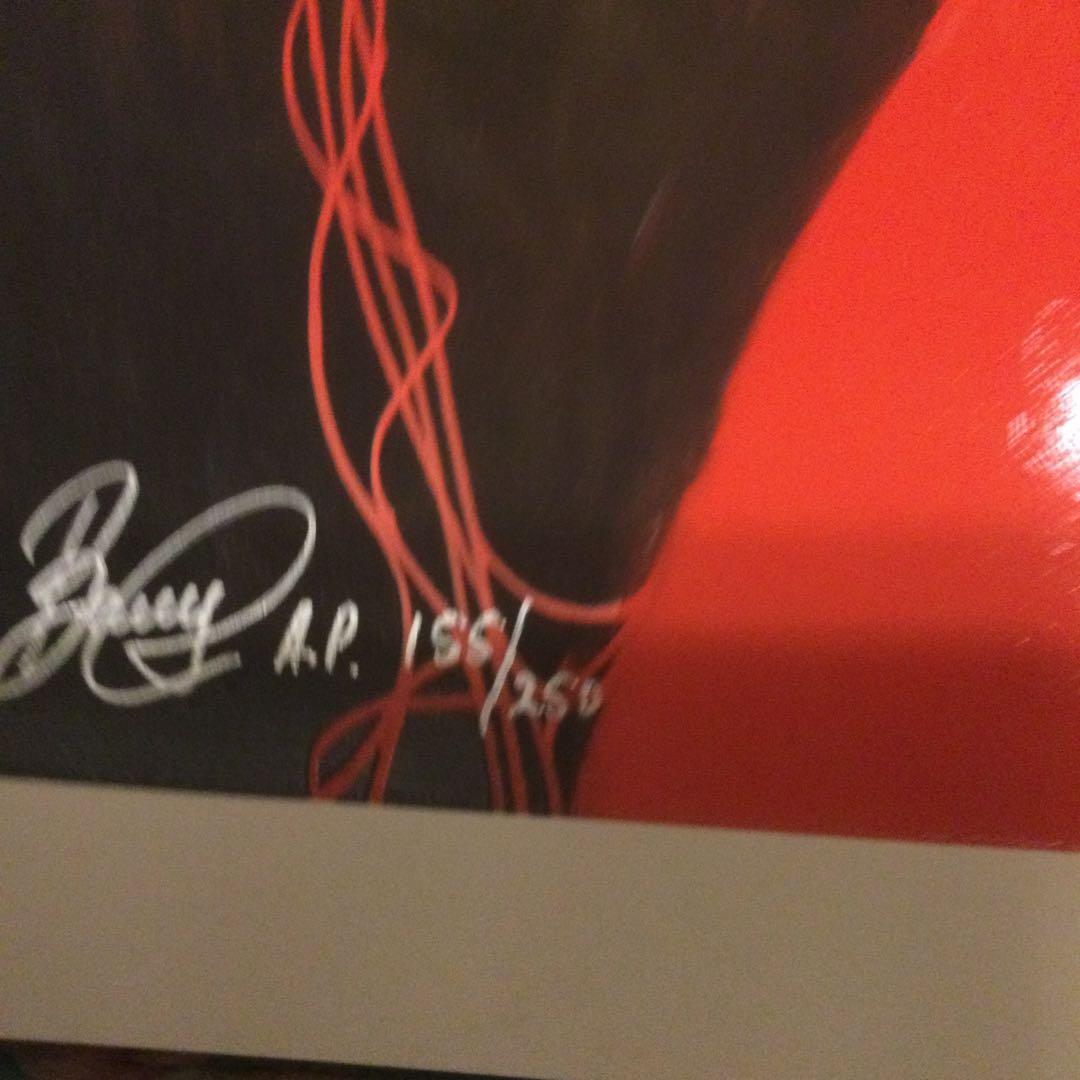 女性のポスター、サイン付き、シリアル番号付き