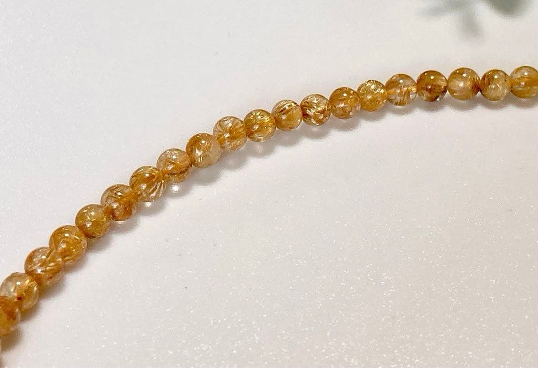 究極品質　超希少幻の逸品　天然石の王者　タイチンルチルキャッツアイの多重編み