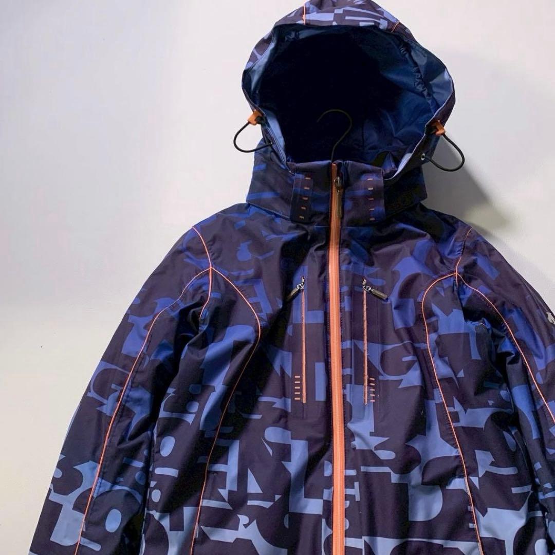 【高機能】デサント スキージャケット モーション3D ヒートナビ 総柄 青 M