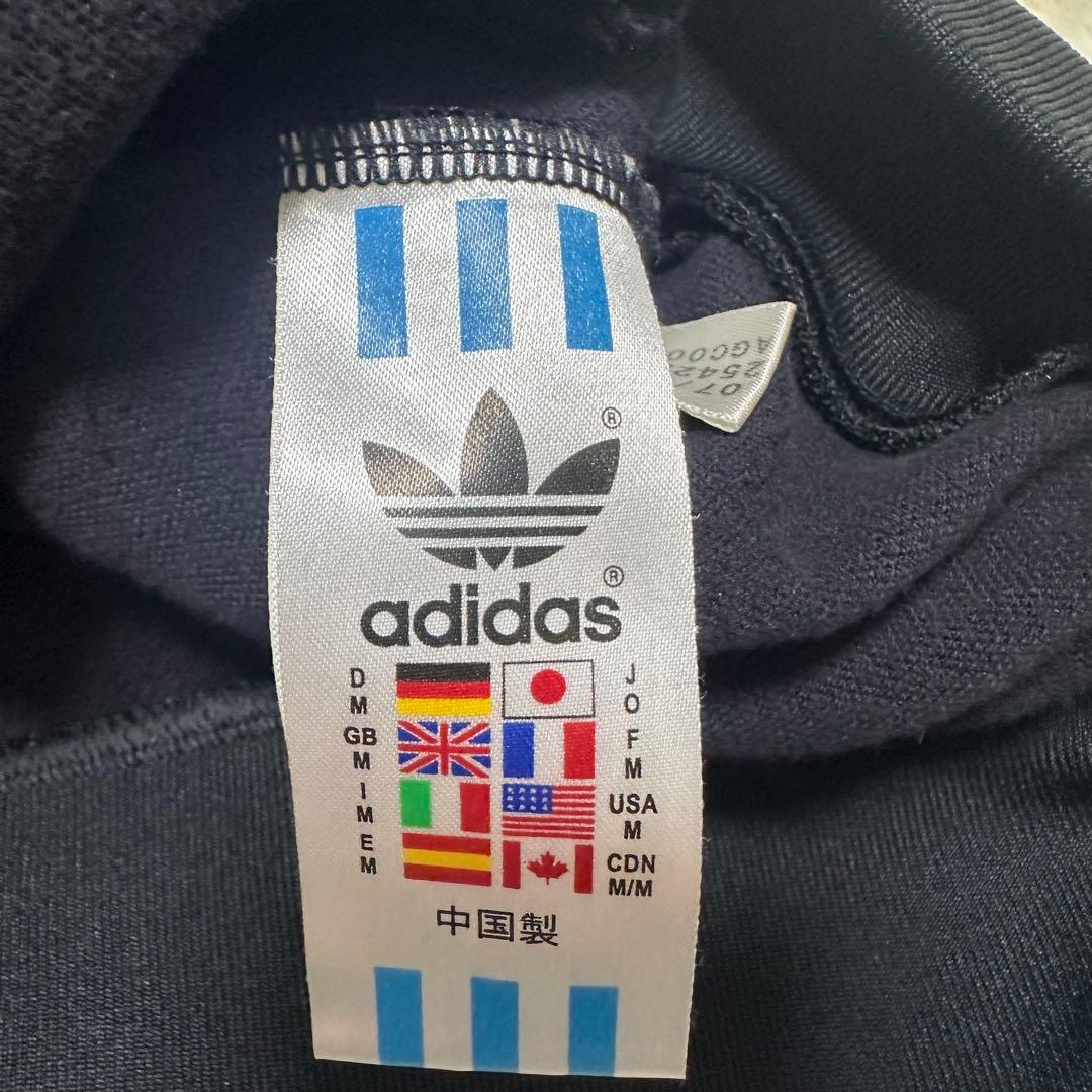 アディダス トレフォイル ロゴ刺繍 トラックジャケット ブラック 黒 金色
