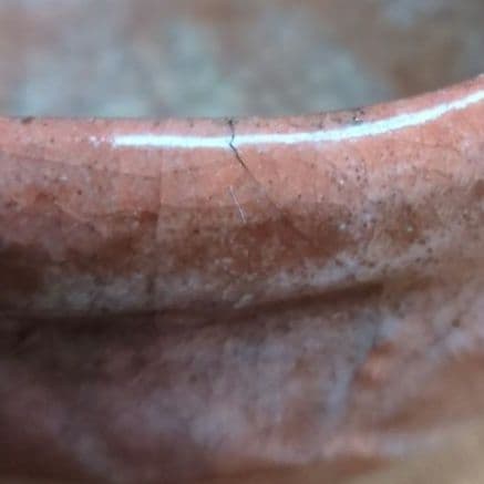 オレンジ色の陶器の茶碗　初代中村道年作赤楽茶碗