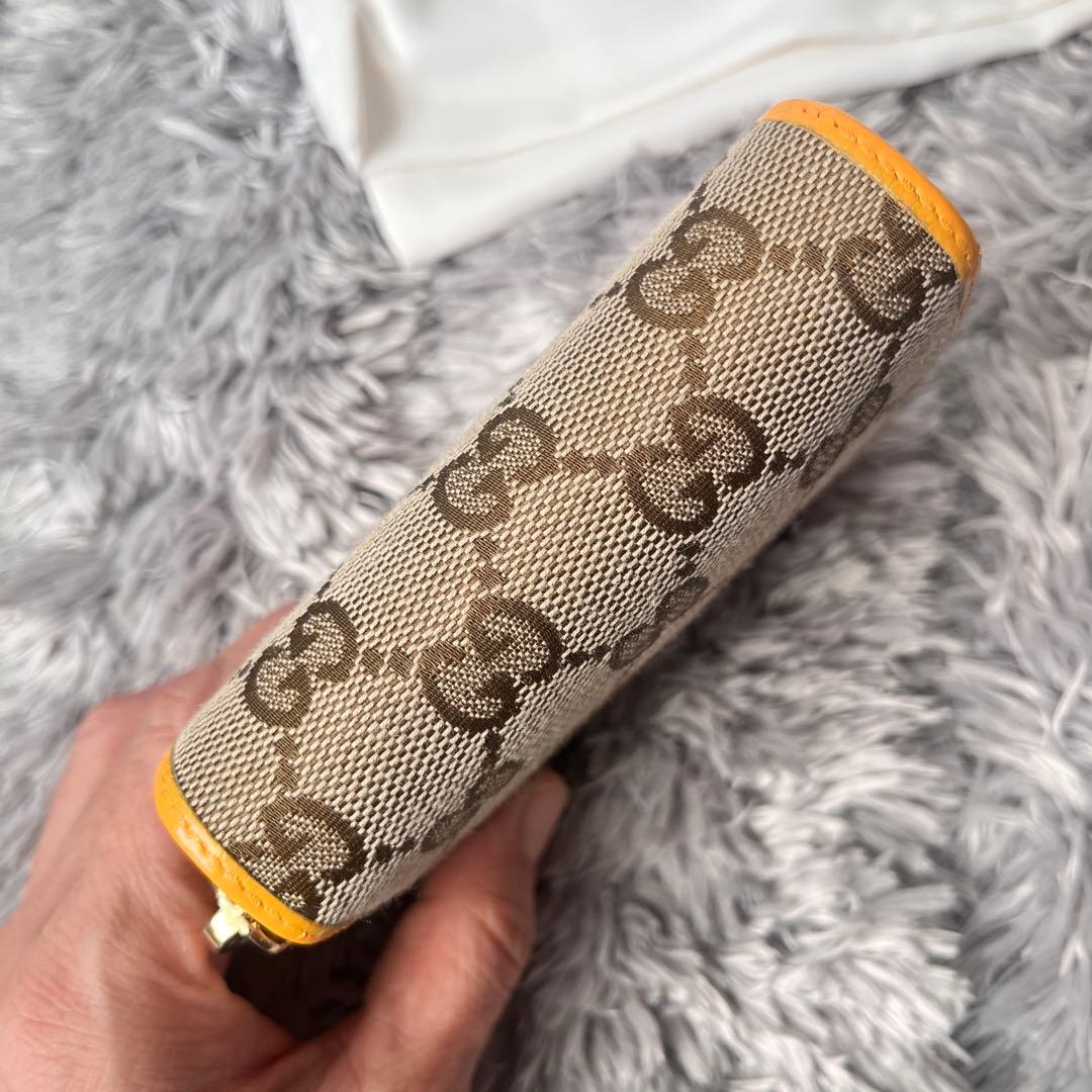 GUCCI 折り財布　GGキャンバス イエロー　ラウンドファスナー