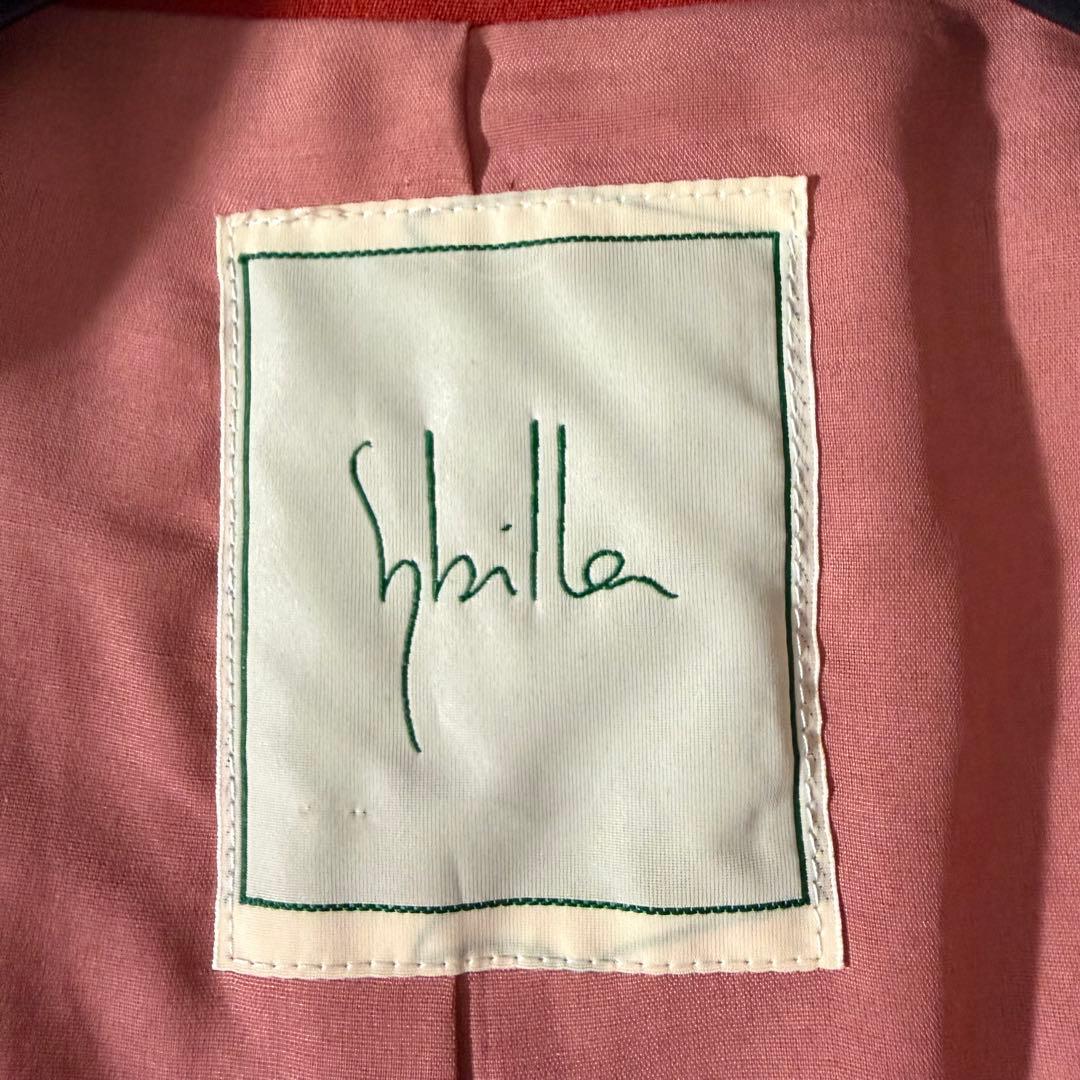 美品 シビラ ノーカラーコート 袖変形 フレア くるみボタン オレンジ