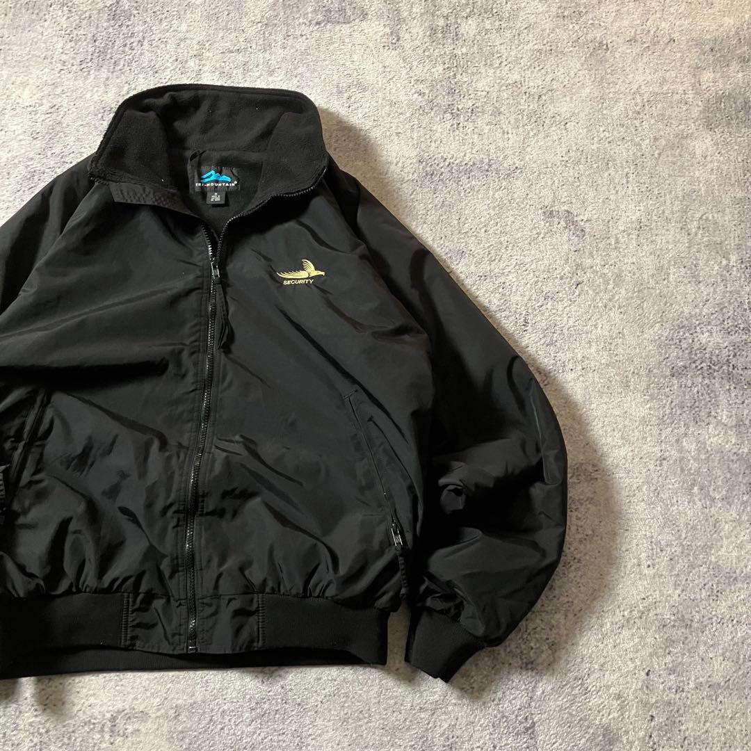 00sTRIMOUNTAIN企業ロゴウォームアップジャケットナイロンブラック黒M