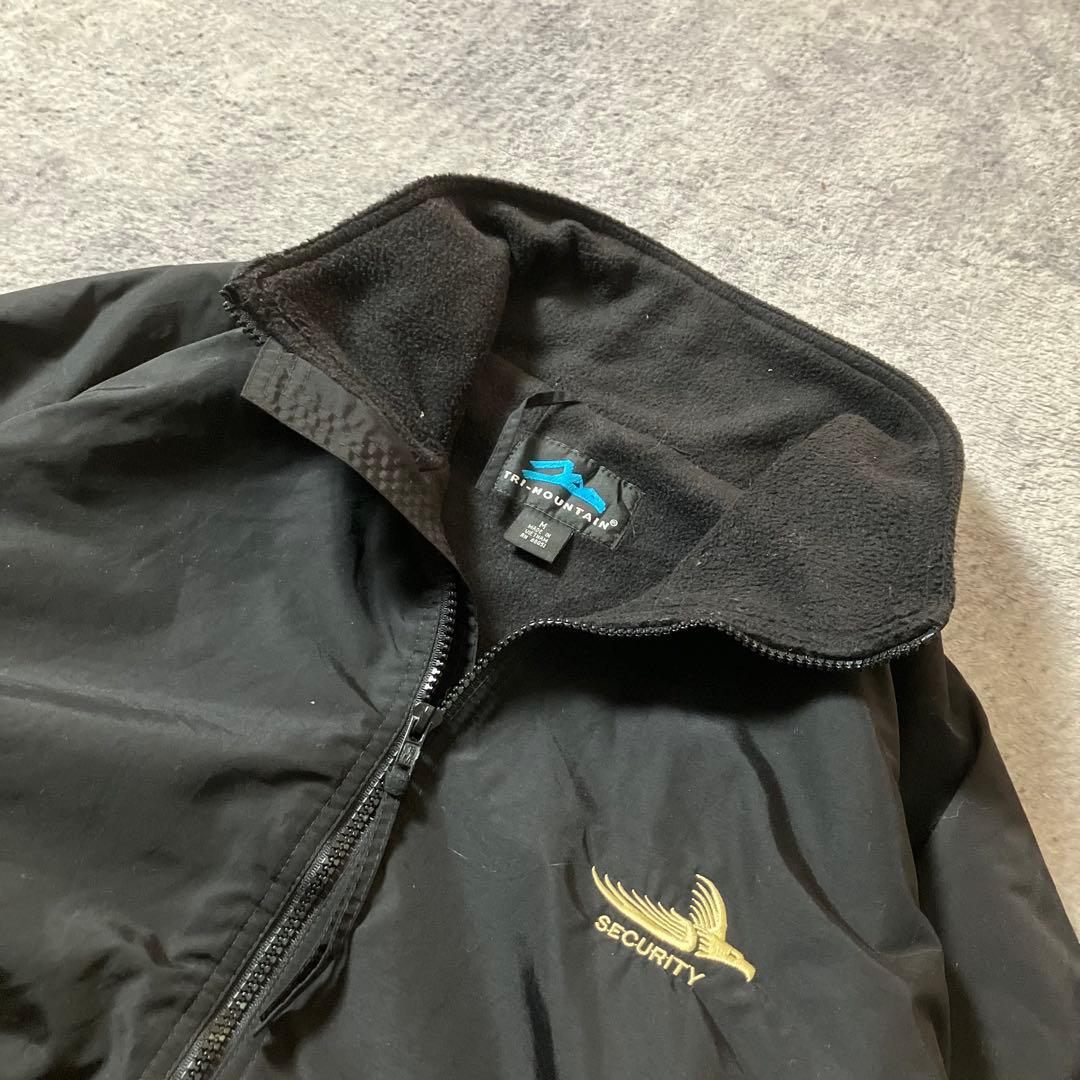 00sTRIMOUNTAIN企業ロゴウォームアップジャケットナイロンブラック黒M