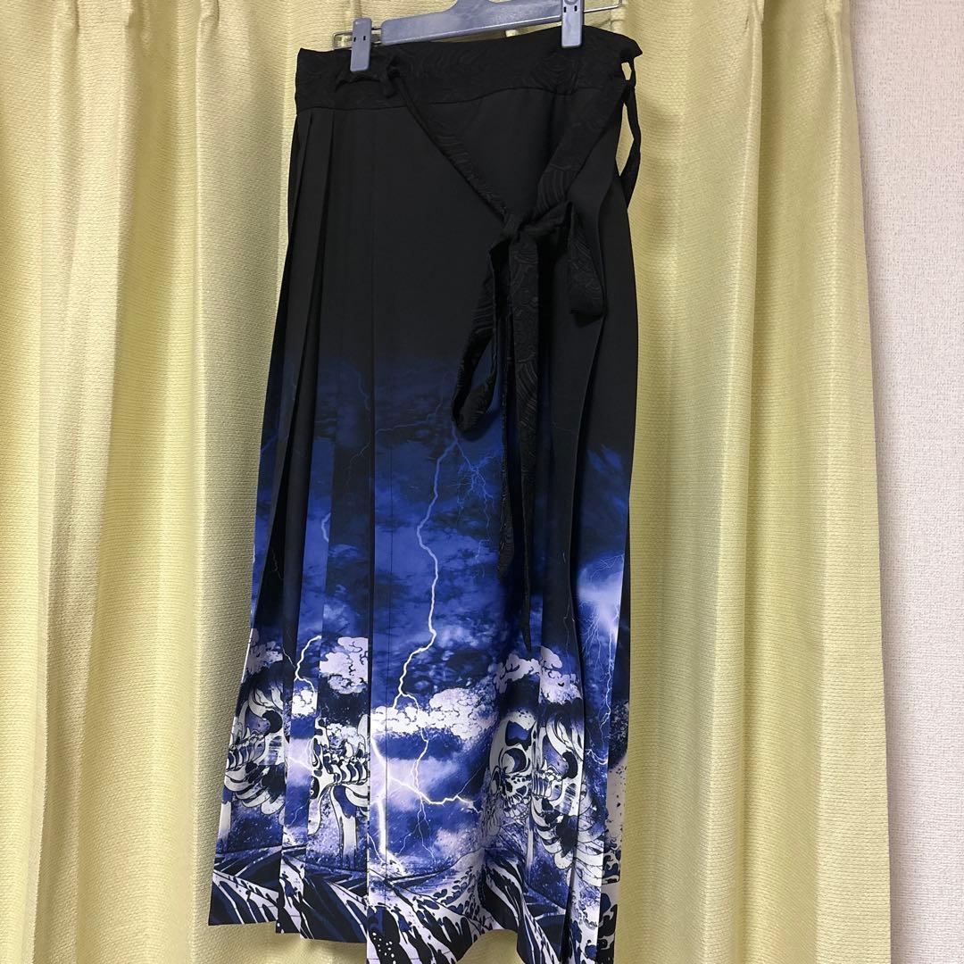 axes femme ガシャドクロ柄巻きスカート