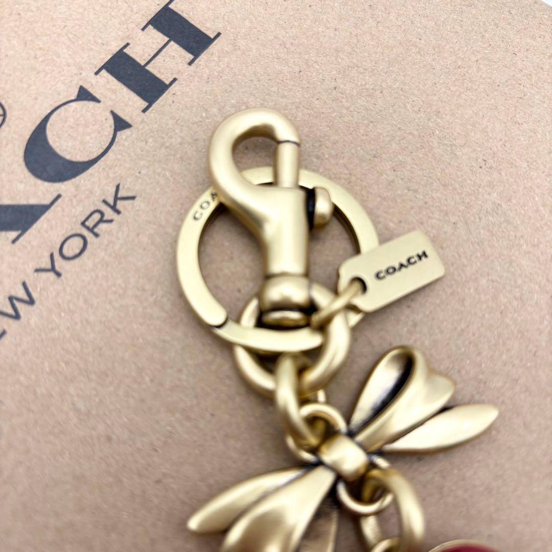 【COACH☆新品】ボウ ハート ロケット☆バッグ チャーム☆ブラス ルビー