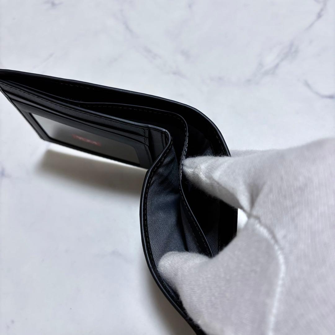 新品未使用 TUMI トゥミ 二つ折り財布 レザー ヘリンボーン 紺 札入