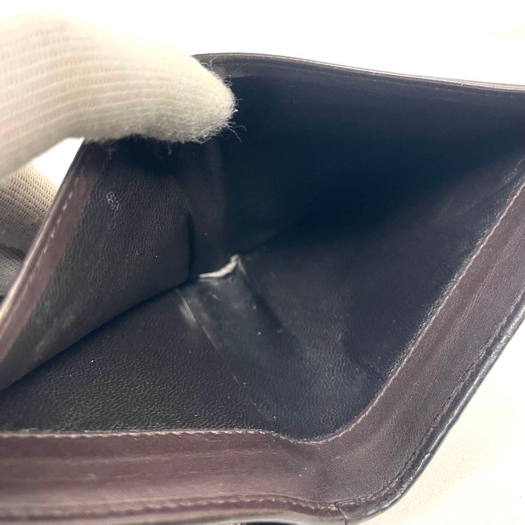 グッチ　二つ折り財布　アビー　シマレザー　ラウンドファスナー　ロゴ　エンボス