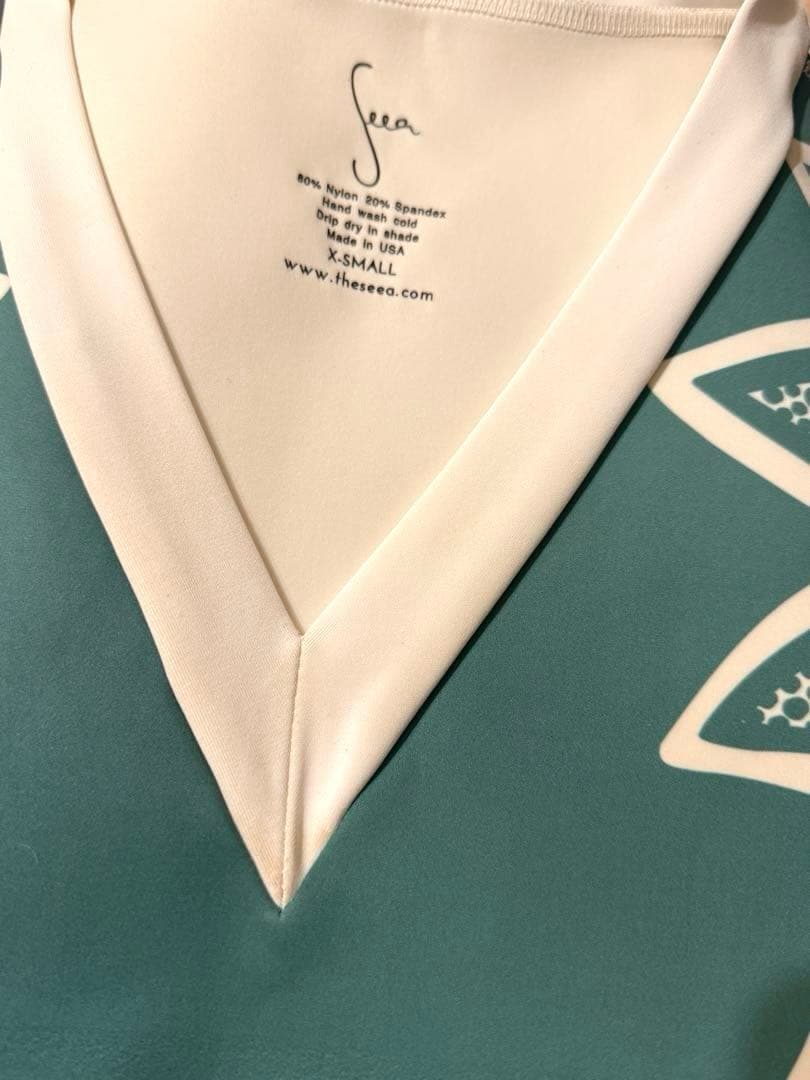 Seea ターコイズのワンピース水着 Vネック