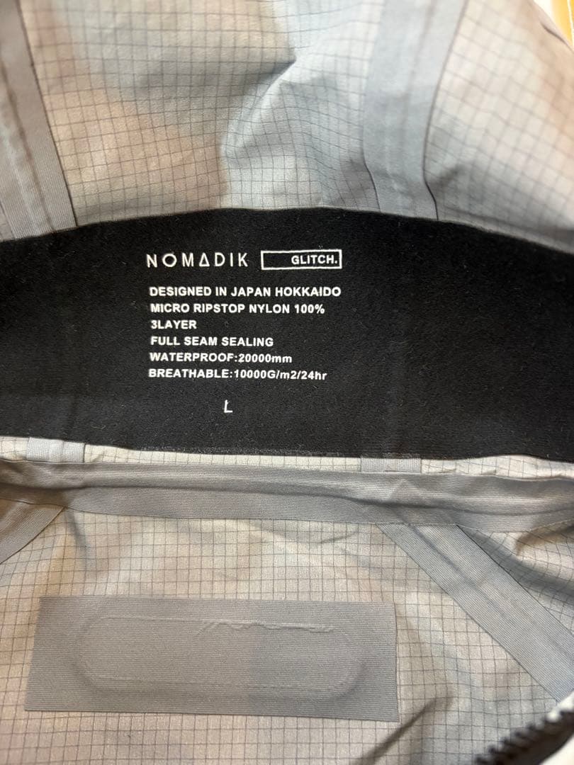 新品 NOMADIK グリッチジャケット　Lサイズ　タグ付送料込み