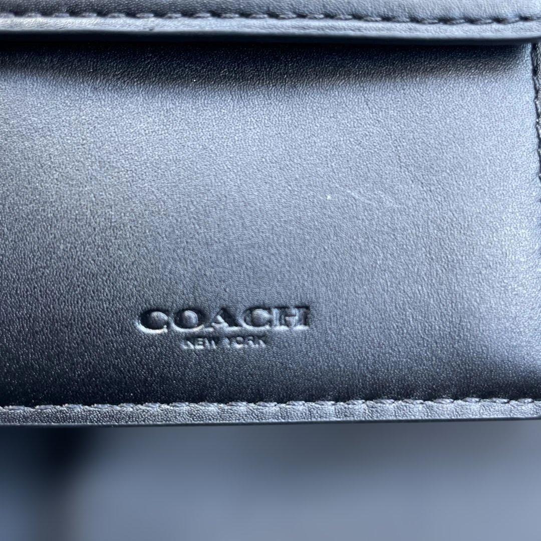 新品　定価55,000円　COACH ブラック　二つ折り財布 エンボス加工