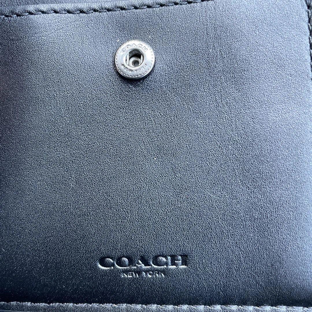 新品　定価55,000円　COACH ブラック　二つ折り財布 エンボス加工