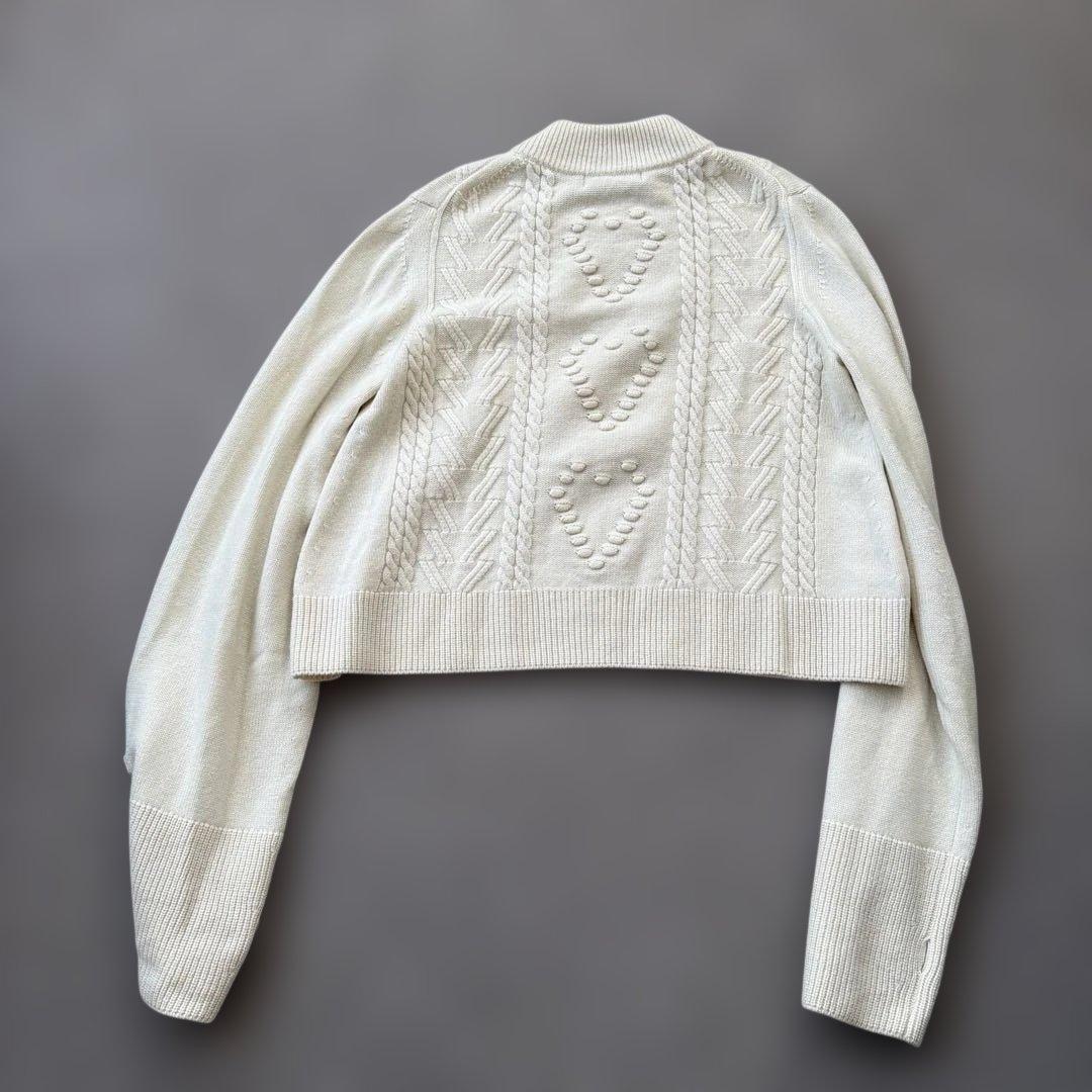 manufactured by WRAPINKNOT ニットトップス