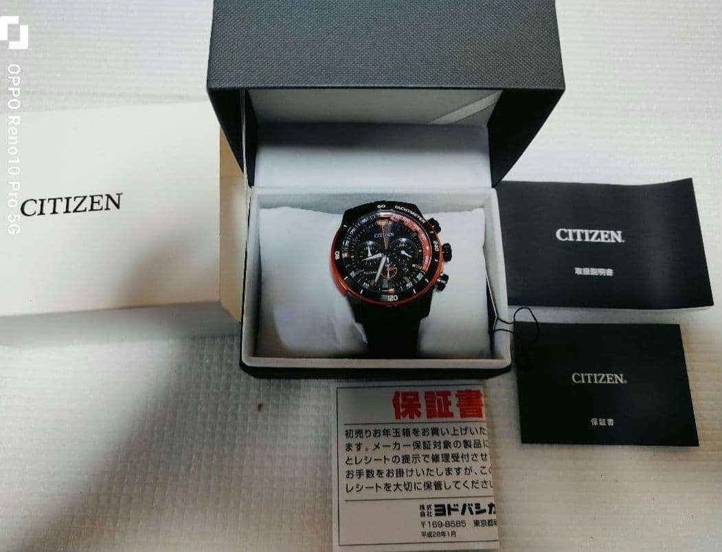 y３７３８１４　CITIZEN エコ・ドライブ ブラック/オレンジ