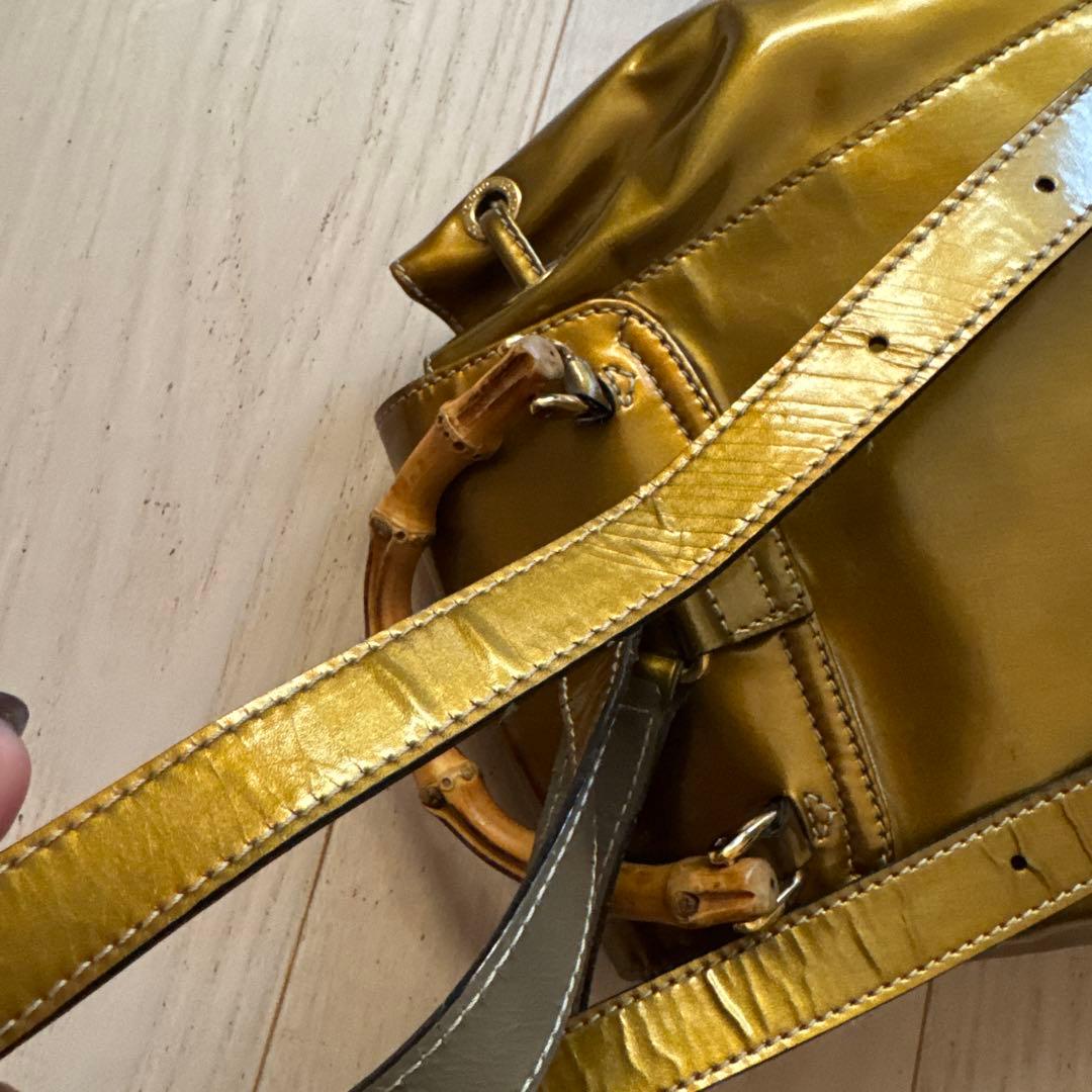 GUCCI エナメルゴールドバックパック