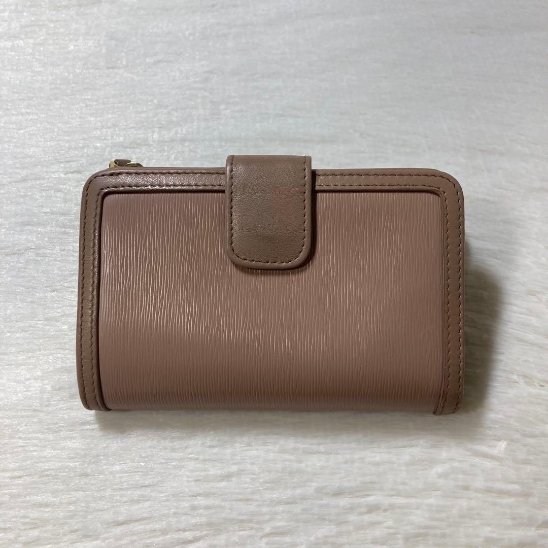 早い者勝ち　PRADA プラダ　人気　リボン　ベージュ　二つ折り　財布　ロゴ　金