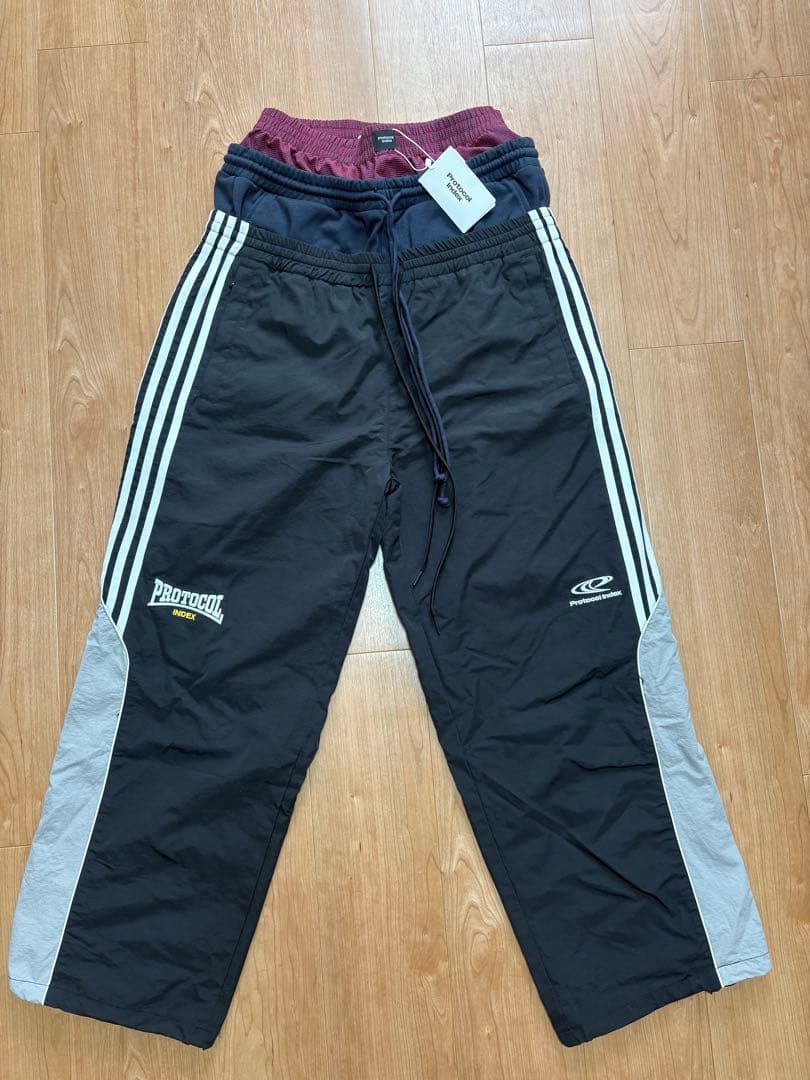 パンツ Protocol Index LAYERED TRACK PANTS / BLK