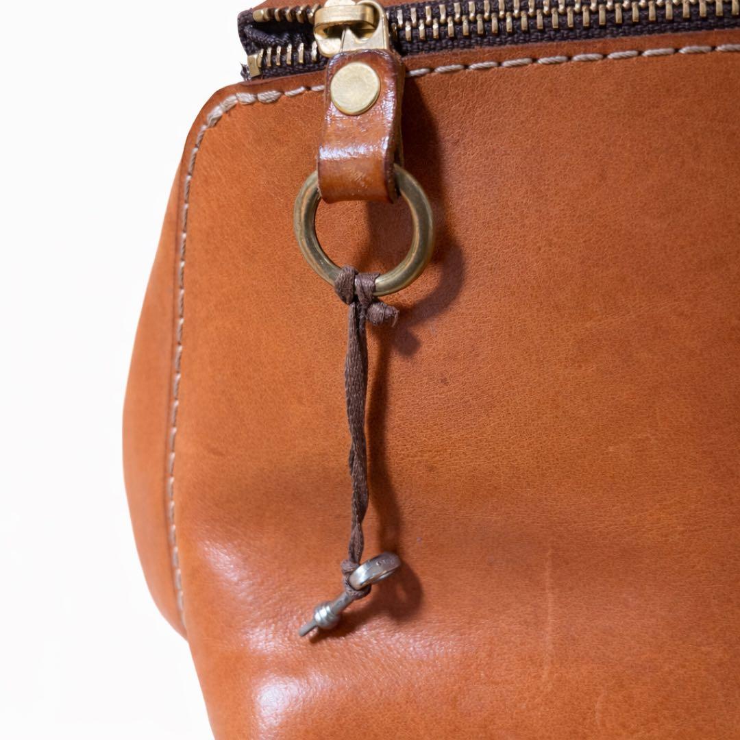 ヘルツ わんぱくリュック がま口 レザー バックパック ロック金具 鍵付き 茶