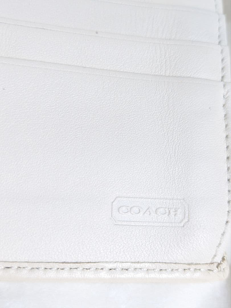 COACH コーチ　三つ折り財布 ピンクと紫のパターンシグネチャー未使用品