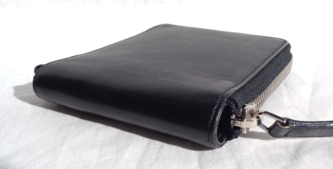 美品 BALENCIAGA パンチングロゴレザーラウンドジップ二つ折り財布 黒