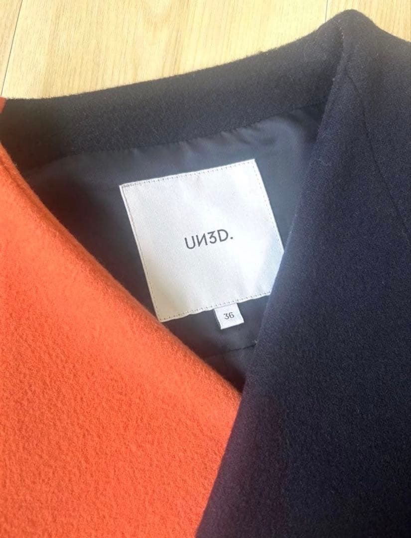 UN3D. アンスリード バイカラーアシンメトリーコート オレンジ×ネイビー