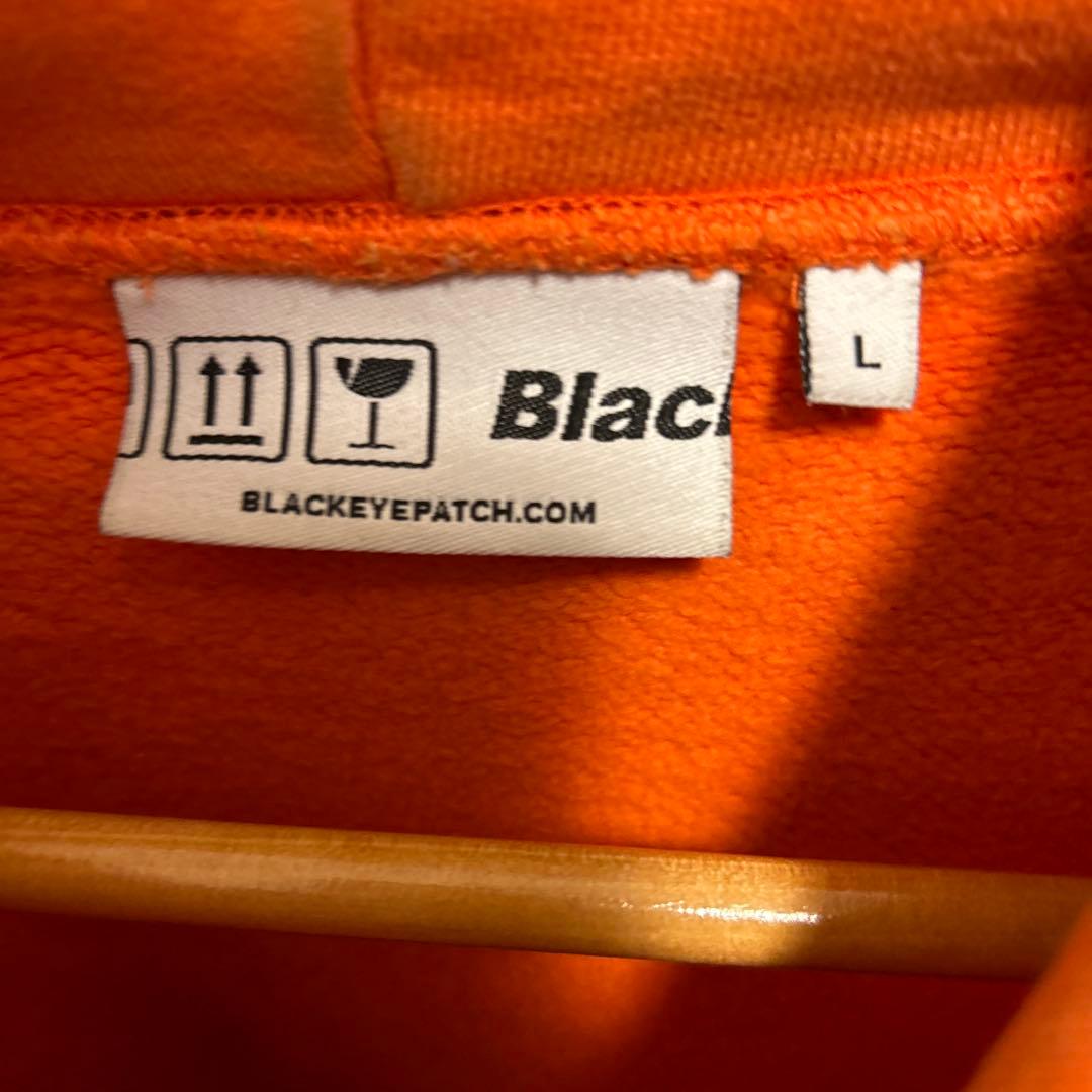 black eye patchブラックアイパッチオレンジパーカー