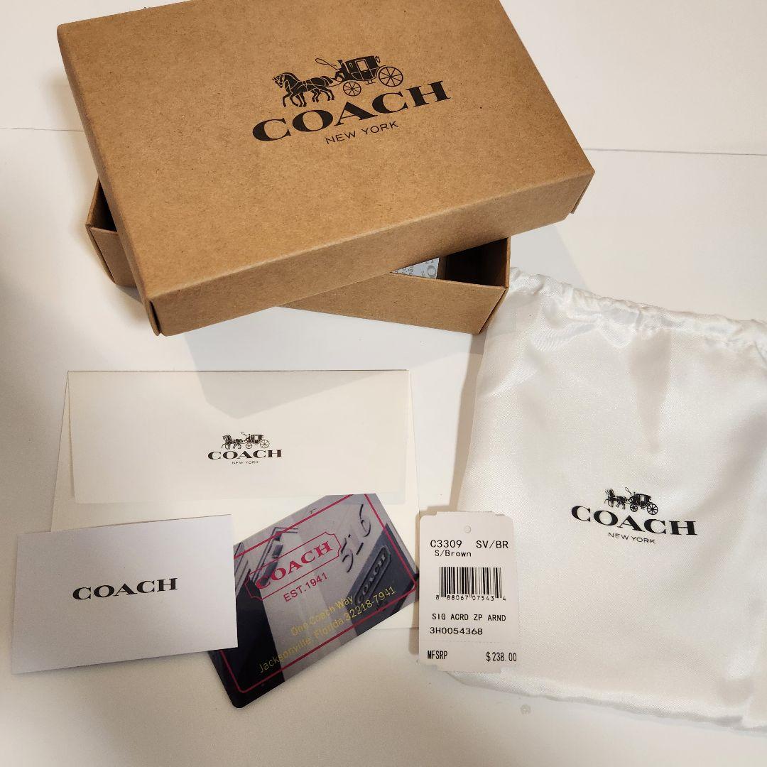 ​【新品・付属品】COACH 二つ折り財布 シグネチャー ブラウン チャーム付