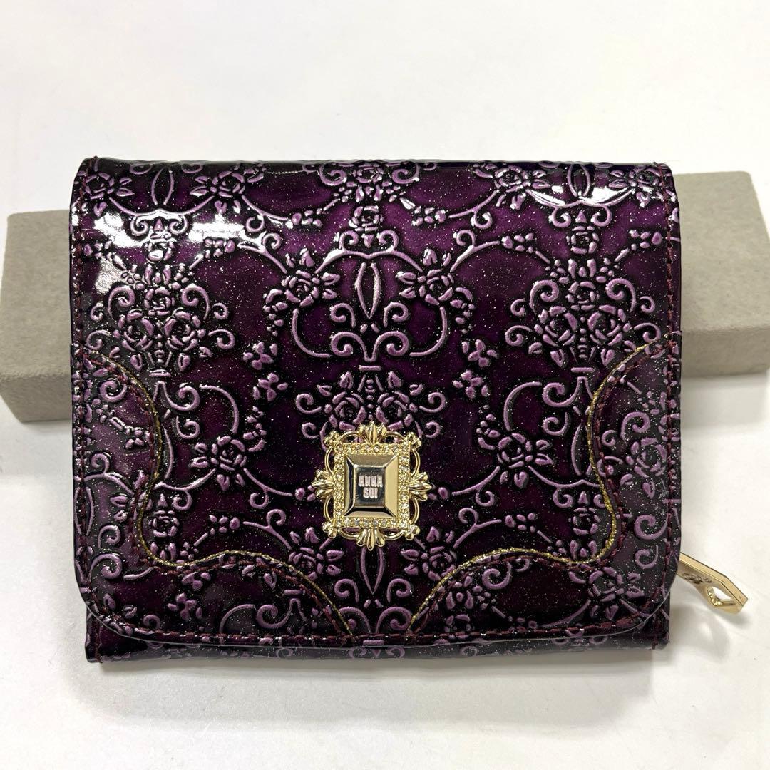 【人気モデル‼︎】ANNA SUI ルーミー　二つ折り財布　薔薇型押し　パープル