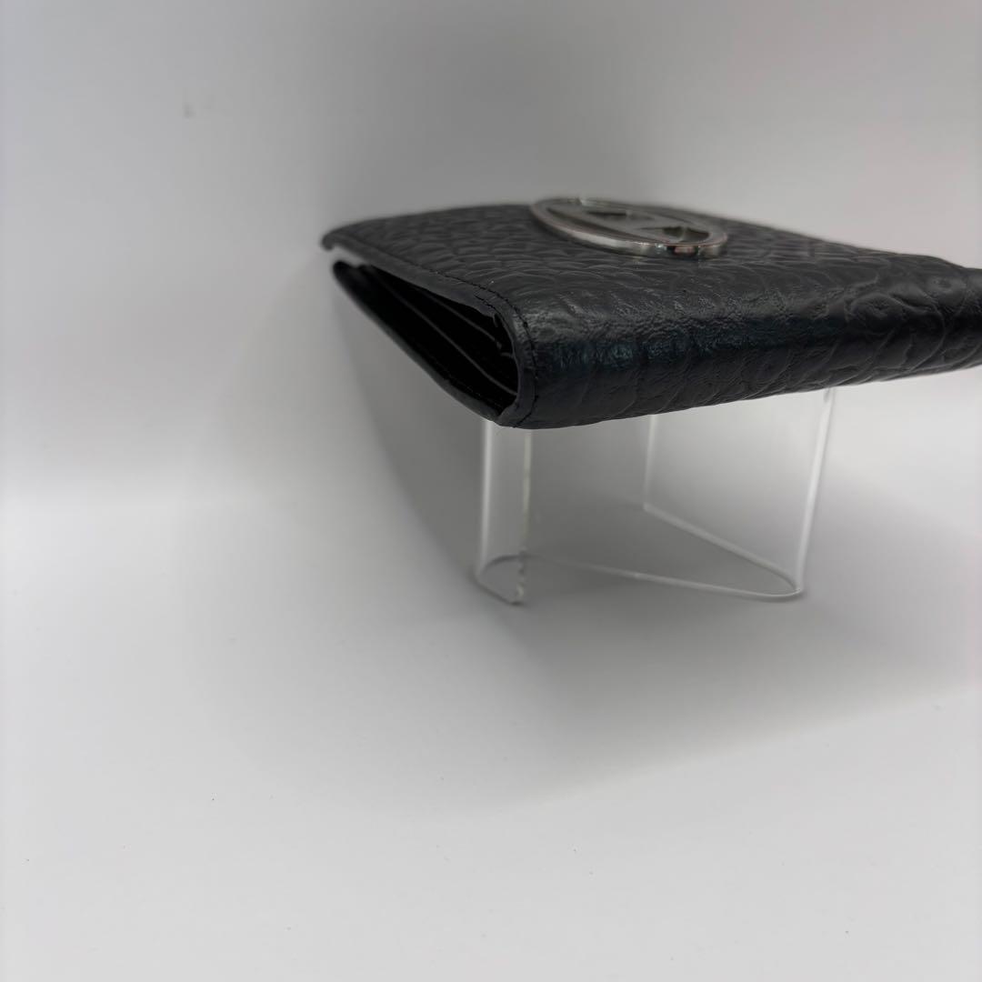 DIESEL 二つ折り財布　ブラック　型押し　D ロゴ　エンボス　シルバー