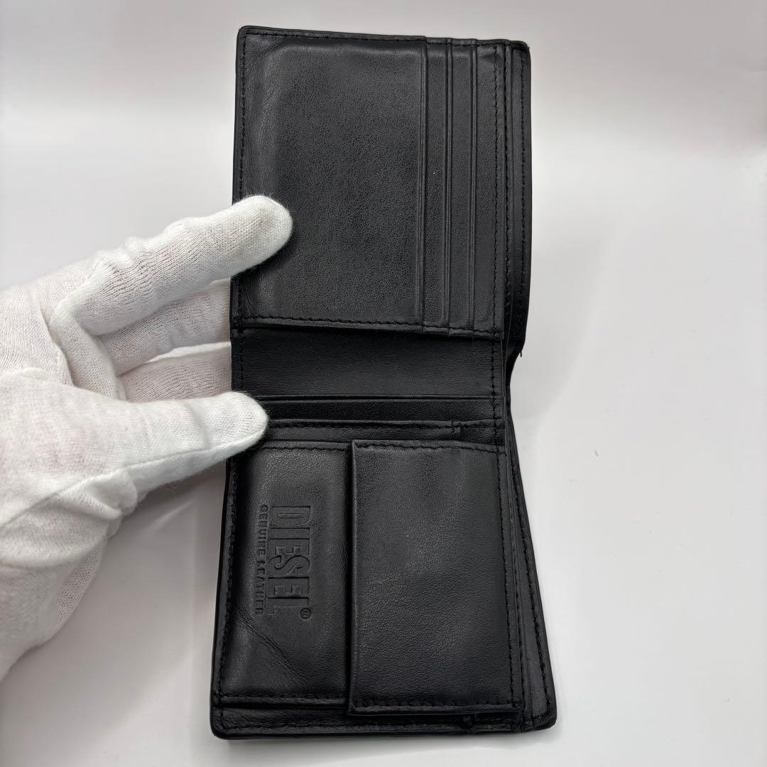 DIESEL 二つ折り財布　ブラック　型押し　D ロゴ　エンボス　シルバー