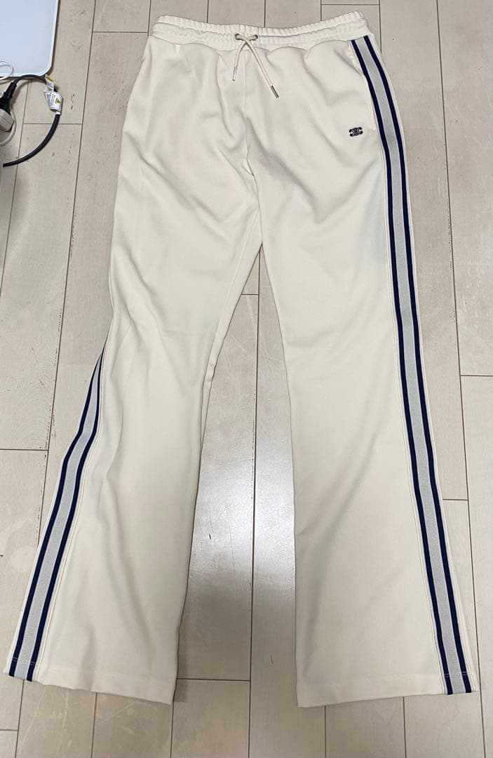 ExxxxxZCELINEサイドライントリオンフフレアトラックロングパンツ