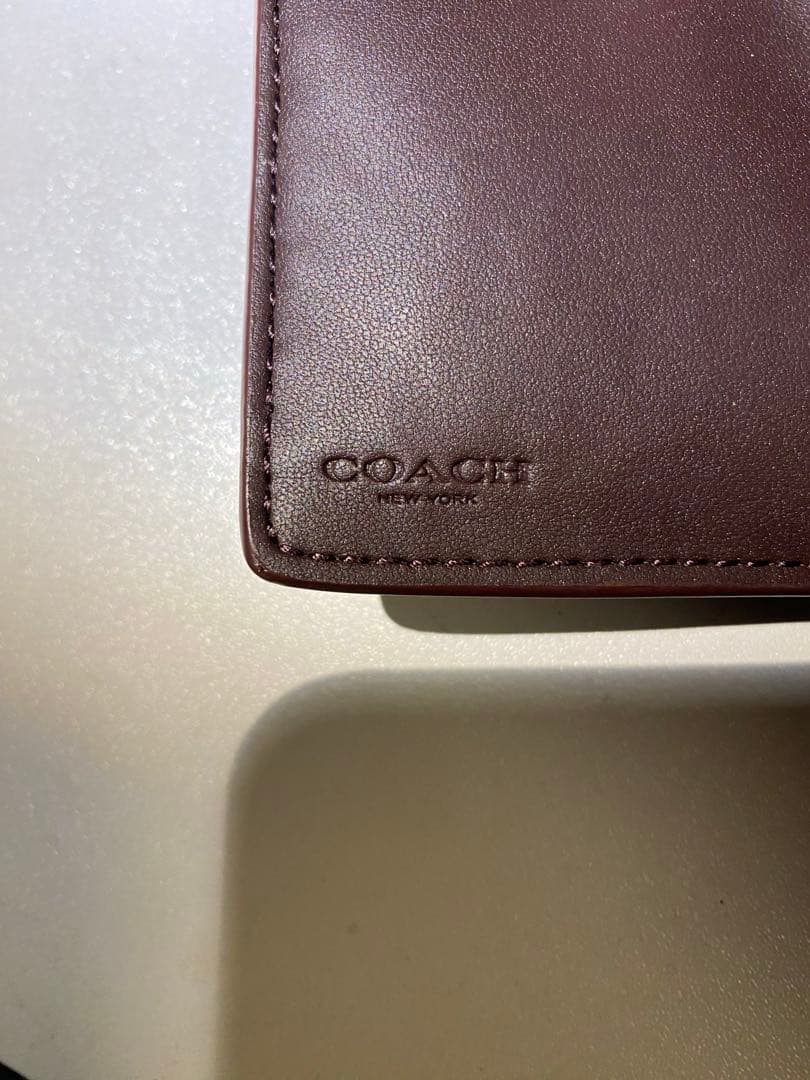 COACH エンボス加工 ブラック 二つ折り財布