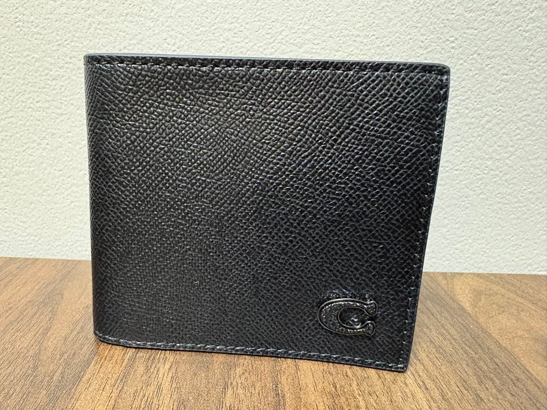 【新品】コーチ　ブラックレザー二つ折り財布