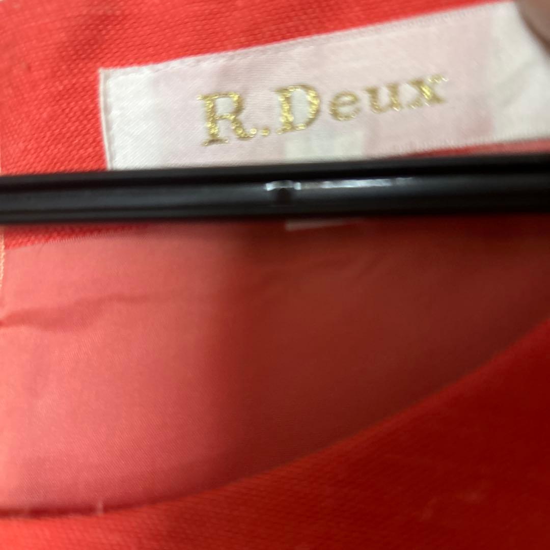 透かし織りの豪華なアンサンブルスーツ　オレンジ系