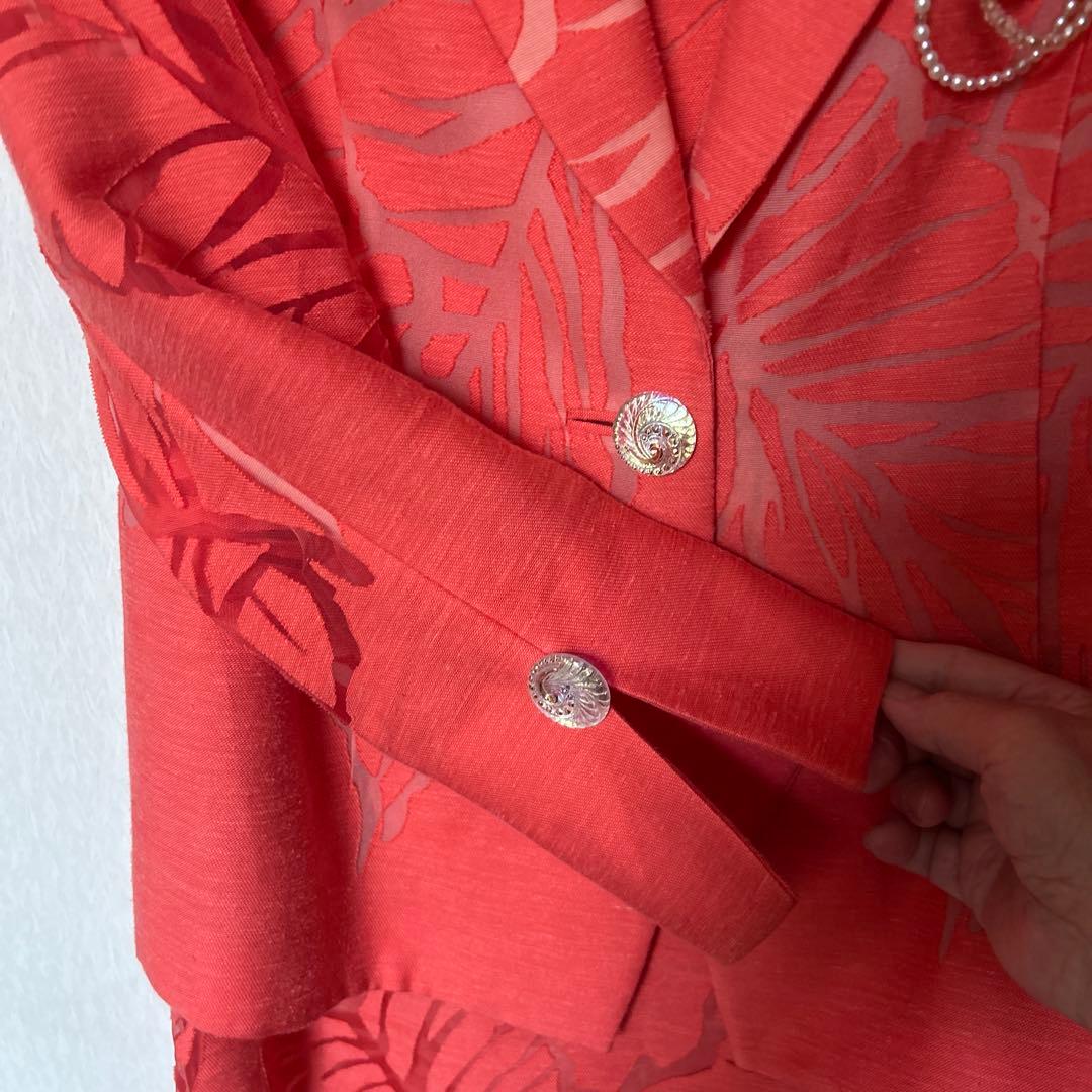 透かし織りの豪華なアンサンブルスーツ　オレンジ系