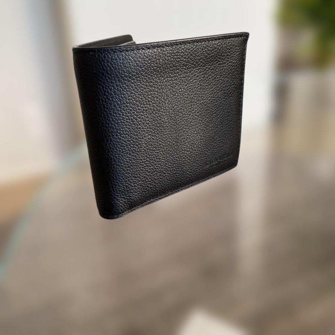 未使用　定価49,500円　COACH ブラック 二つ折り財布 ポケット付