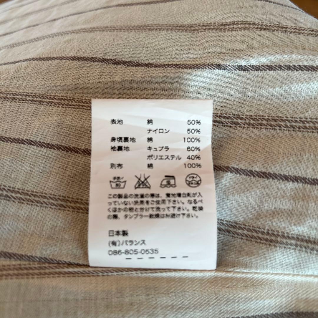 ANACHRONORMのステンカラーコート