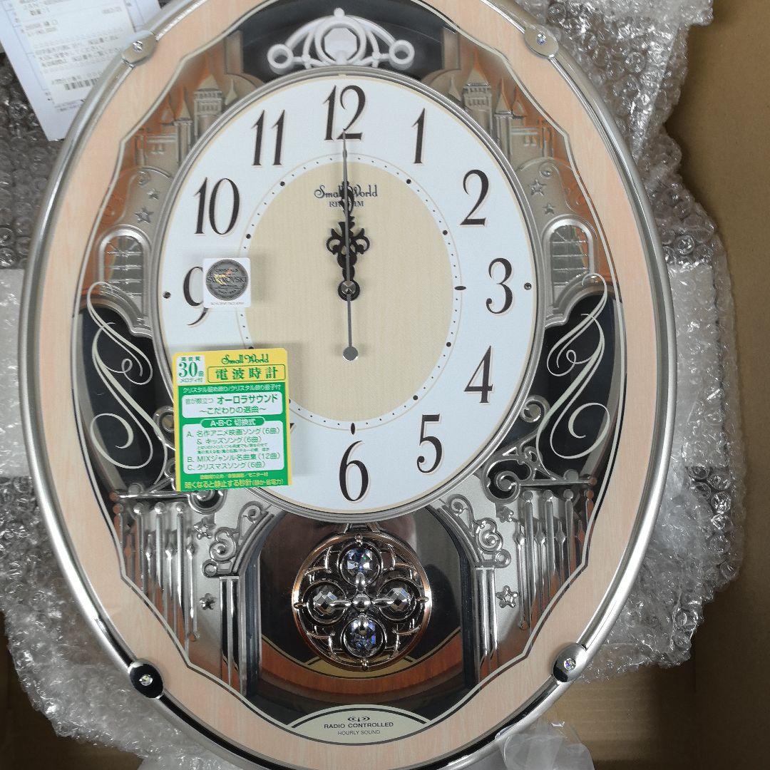 ア*ェ様 【新品】スモールワールドクラッセ　報時電波壁掛け時計　３０曲メロディ