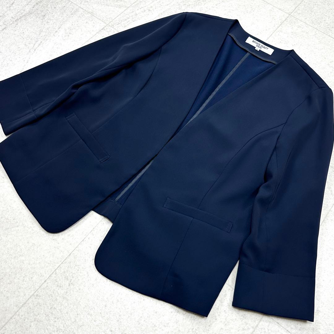 【ナチュラルビューティー】セットアップ ノーカラー パンツ スーツ 38 紺