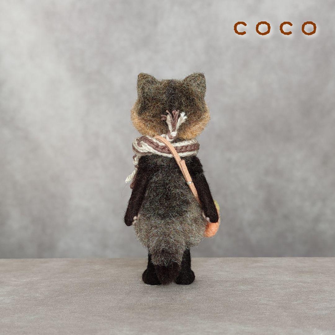 柿ポシェットを下げたたぬきさん