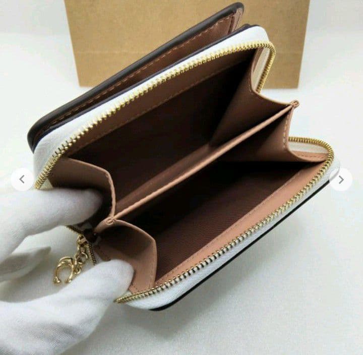 新品未使用コーチ二つ折り財布スヌーピー柄ホワイトレディースメンズ送料無料即日発送