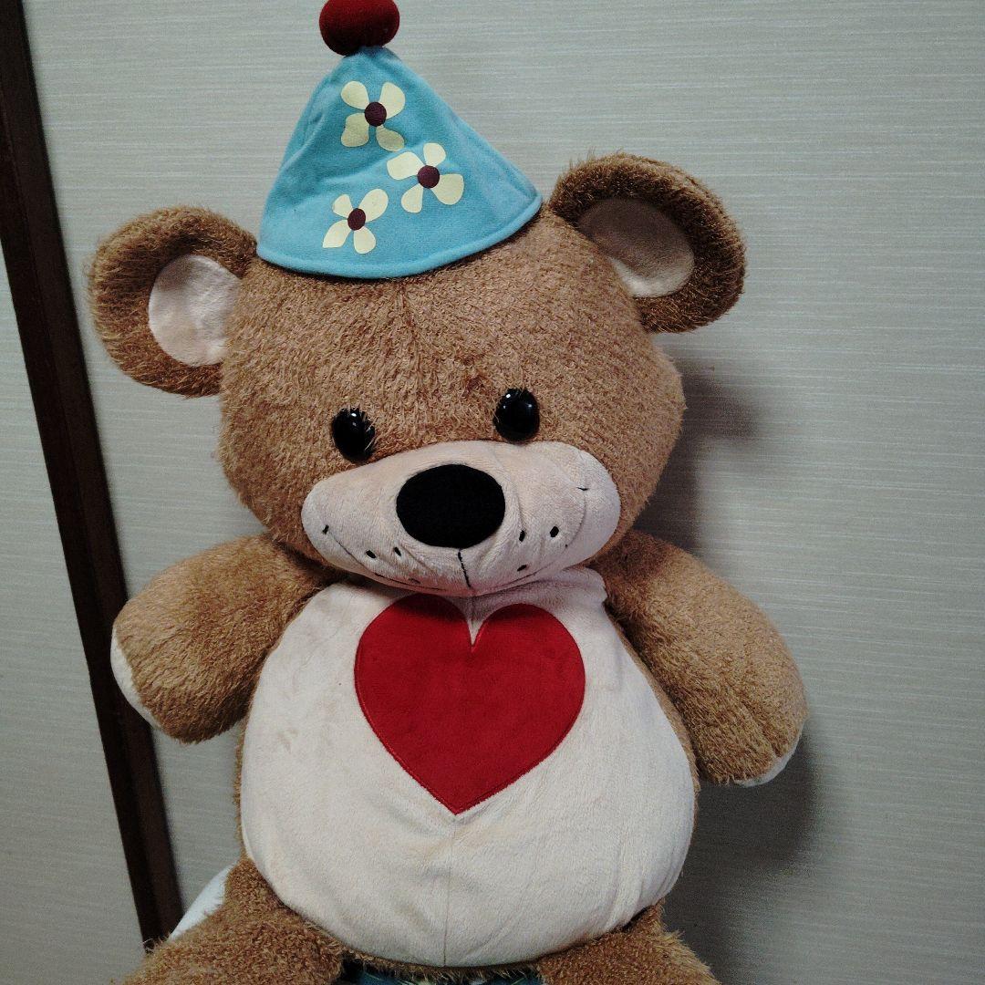 茶色いクマのぬいぐるみ 青い帽子付き