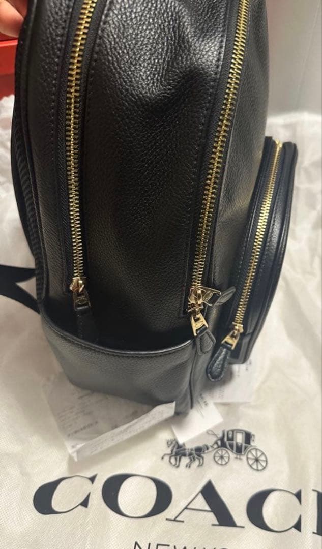 バッグ COACH PEBBLED LEATHER COURT BACKPACK