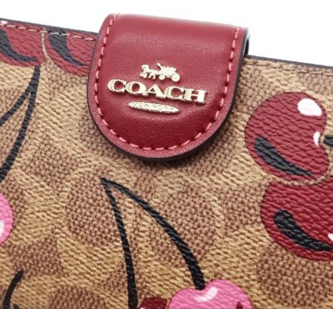 COACH 二つ折り財布 シグネチャー チェリー柄 CZ342