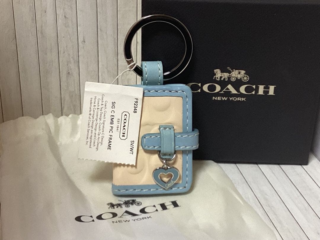 未使用タグ付きCOACH 水色キーホルダーSLC EMB R/C FRAME本物