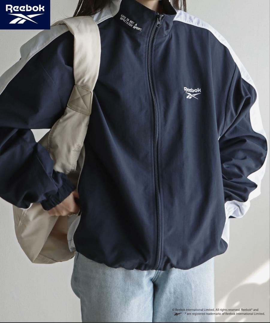 【Reebok】 別注スモールベクター刺繍裾ドロストナイロンジャケット