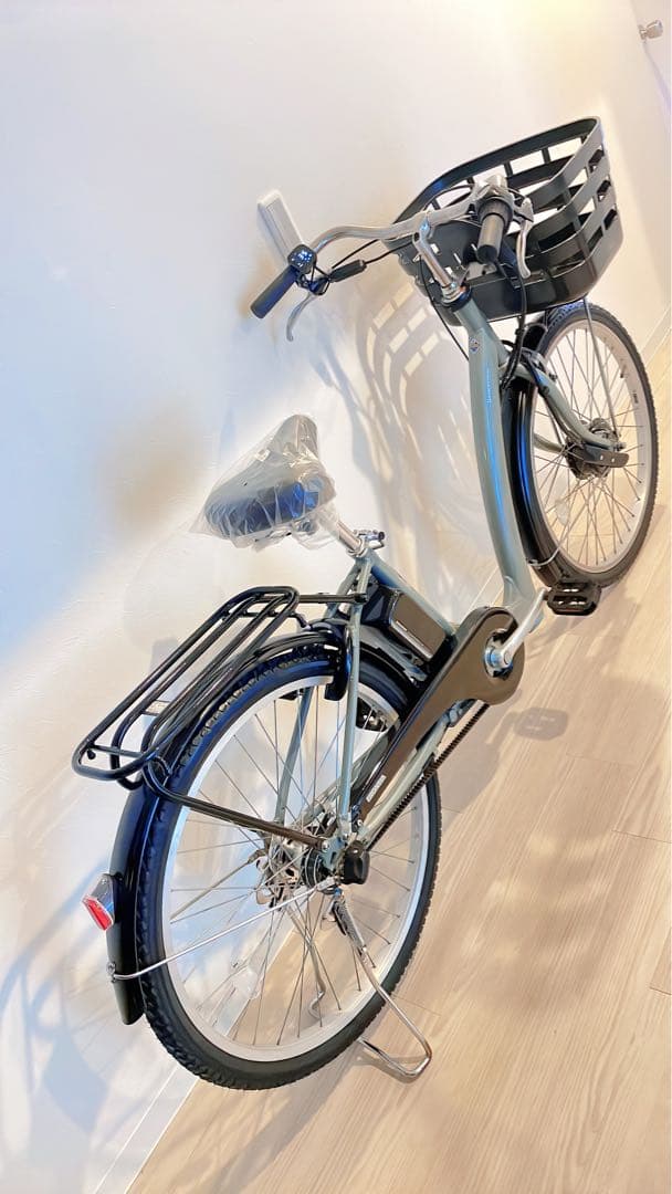 ブリヂストンの電動アシスト自転車、26インチ、ターコイズ。