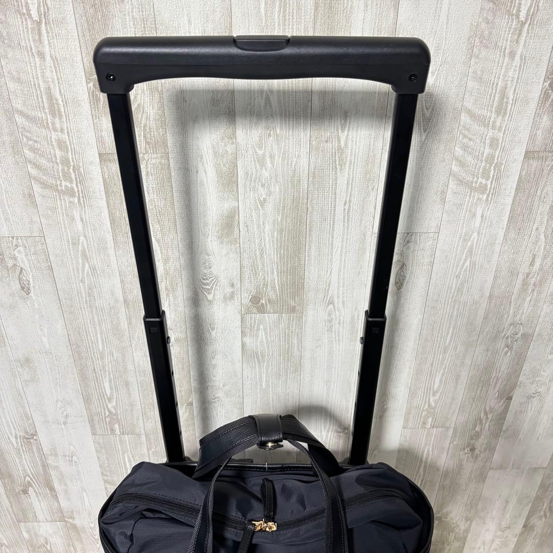 ⭐️美品⭐️スワニー キャリーバッグ 4輪ストッパー付　黒　リボン